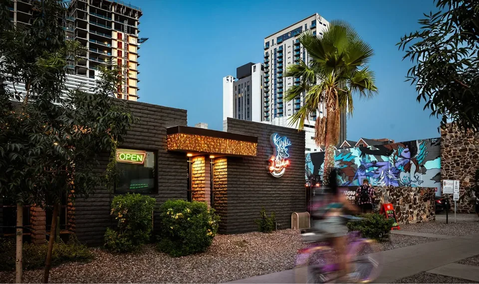 Lucky’s exterior and mural at dusk