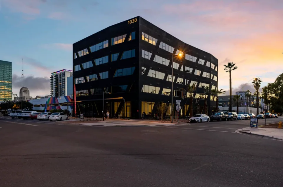 Completed Rainbow Road apartment building at dusk