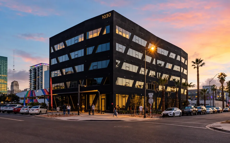 Completed Rainbow Road apartment building at dusk