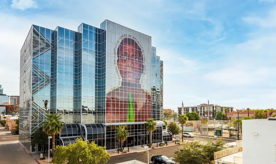 TEN-O-ONE viewed from across Central Avenue with its large portrait mural