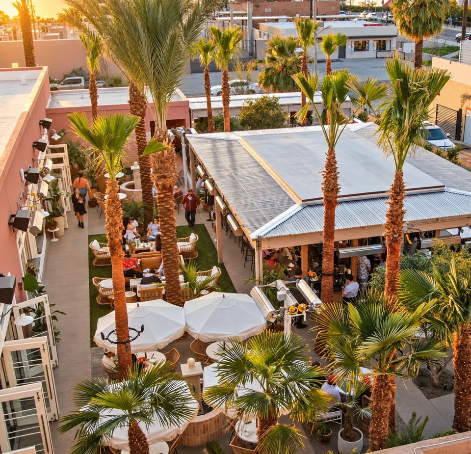 Palma courtyard with palms and outdoor dining at sunset